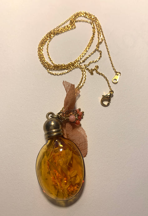 Amber glass floral terrarium necklace